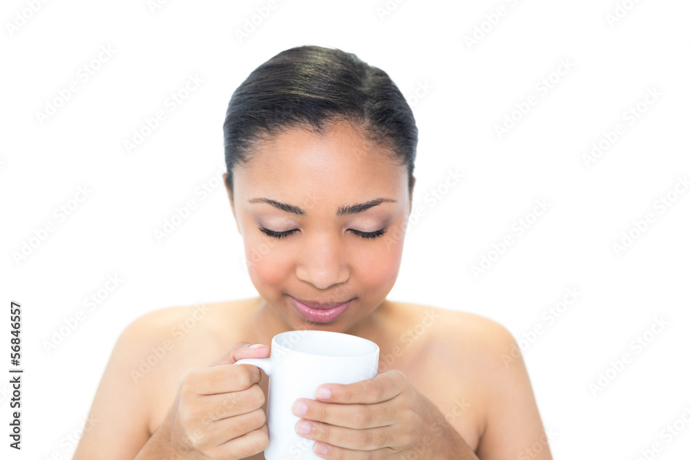 Relaxed young dark haired model enjoying coffee smell Relaxed young dark haired model enjoying coffee smell