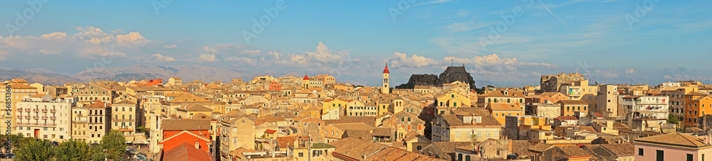 Panoramic shot of Corfu city with blue cloudy sky. Sen from abov