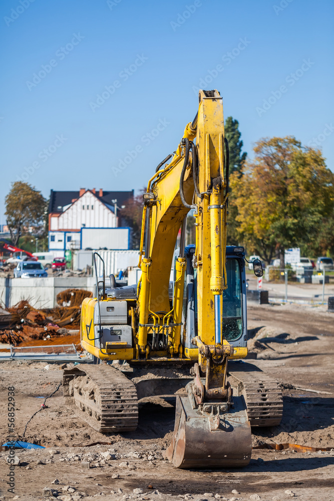 Excavator - focus on the arm and bucket.