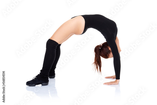 Athletic supple woman arching her back