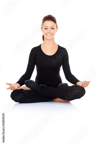 Beautiful woman meditating in the lotus position