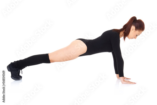 Athletic young woman doing press ups