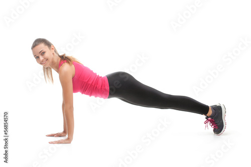 Smiling beautiful woman doing exercise