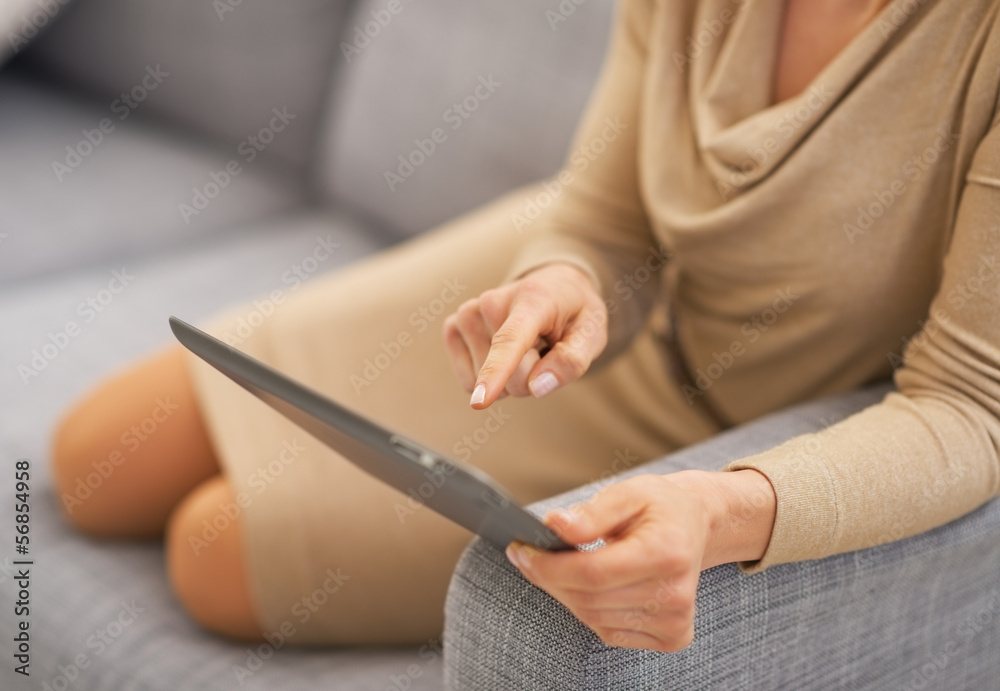 Closeup on woman using tablet pc