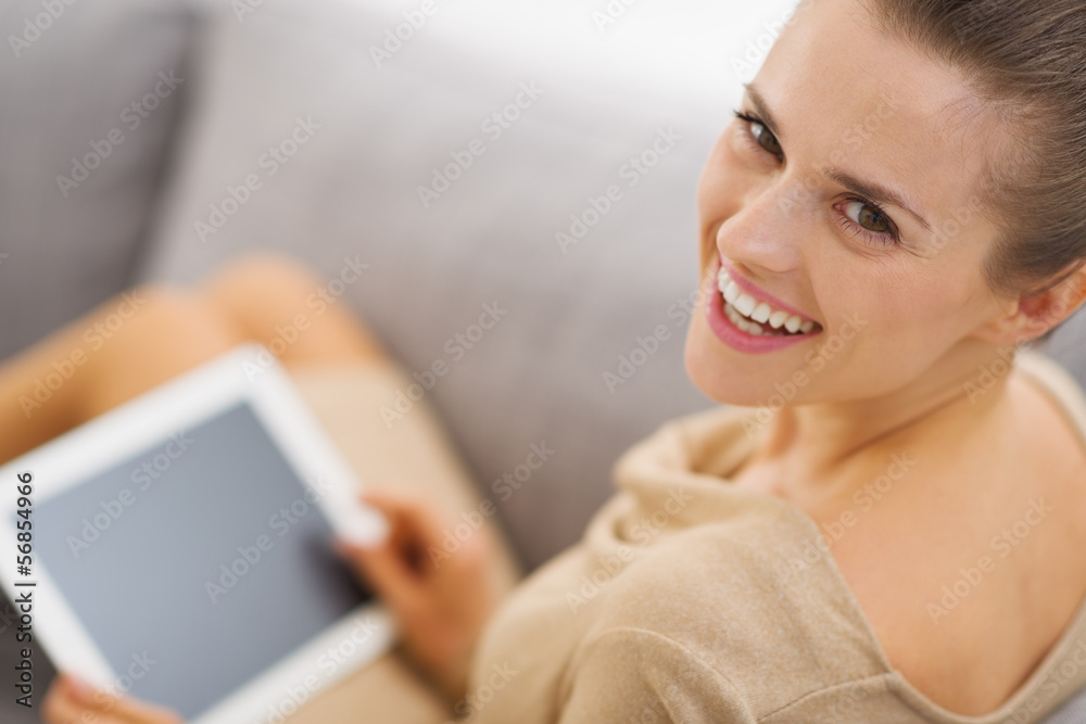 Portrait of smiling young woman with tablet pc Portrait of smiling young woman with tablet pc