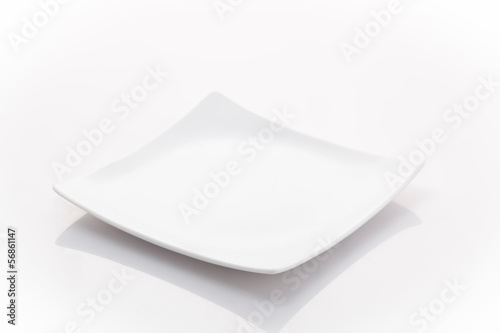 one empty square plate isolated on a white background