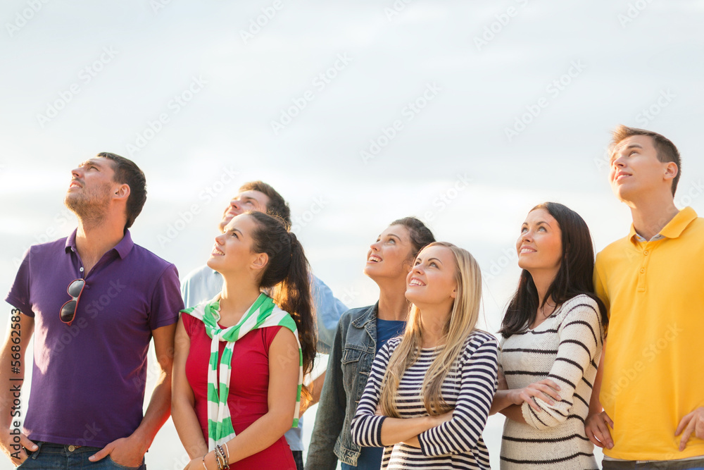 group of friends looking up on the beach group of friends looking up on the beach