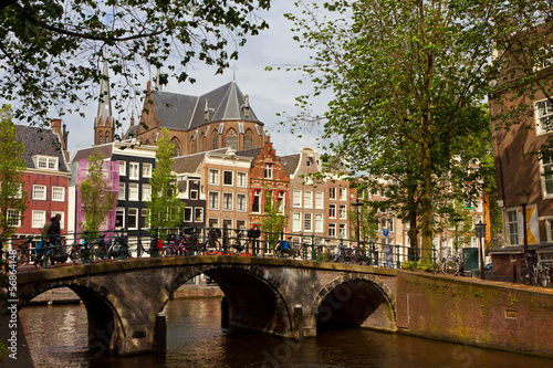 Amsterdam canals with bridge and typical dutch houses