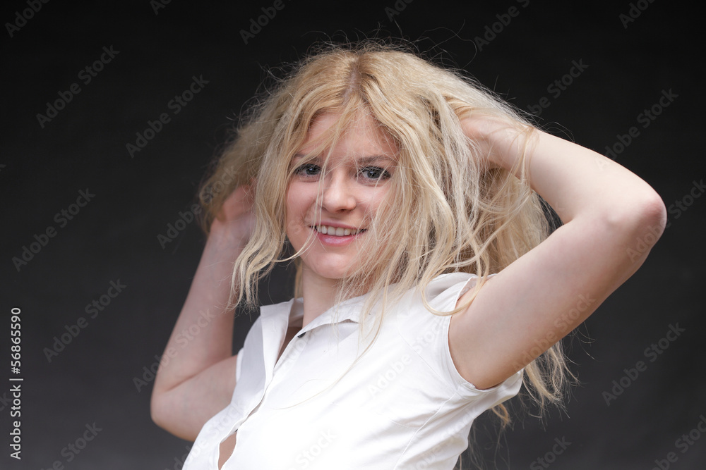 Blonde woman with her hair blowing