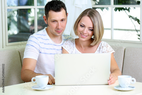 Young couple  with laptop, ...
