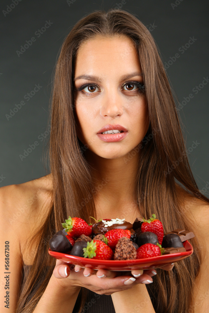 Portrait of beautiful young girl with chocolate sweets Portrait of beautiful young girl with chocolate sweets