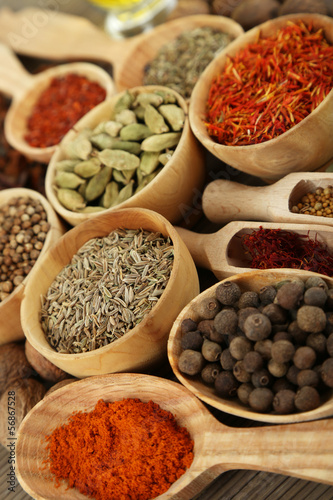 Many different spices and fragrant herbs close-up background