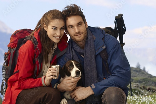 Happy hikers with dog