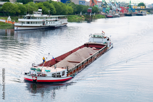 barge  on the river Fototapeta