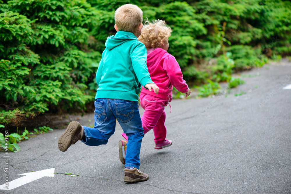 Little brother and sister running Little brother and sister running