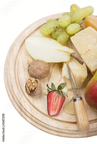 cheese and fruit on a white background