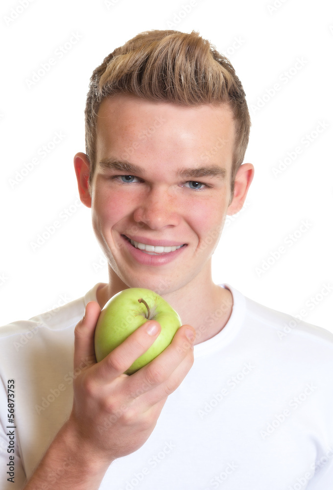 Sporty guy showing an apple Sporty guy showing an apple