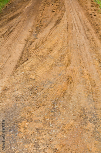 Background traces wheel vehicles on the road surface clay