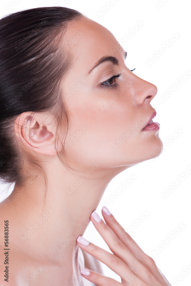 Beautiful woman cares for the skin neck- posing at studio Beautiful woman cares for the skin neck- posing at studio