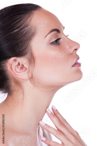 Beautiful woman cares for the skin neck- posing at studio