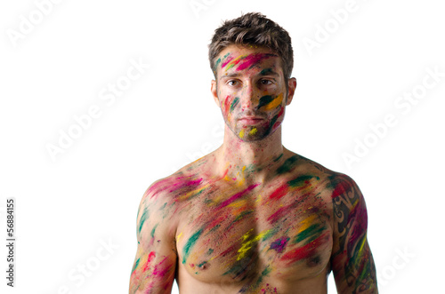 Schilderij op canvas Athletic young man shirtless, skin painted with Holi colors