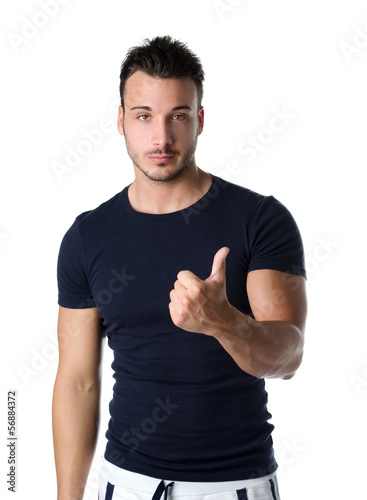 Handsome young man counting to one with fingers and hands