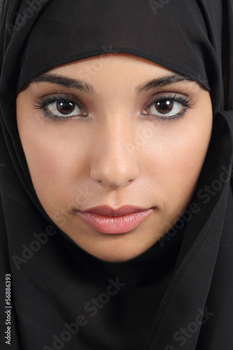 Portrait of a beautiful arab woman face with a black scarf photo