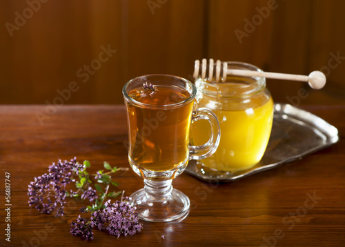 Still life from medicinal herbs, honey, herbal tea on a wooden