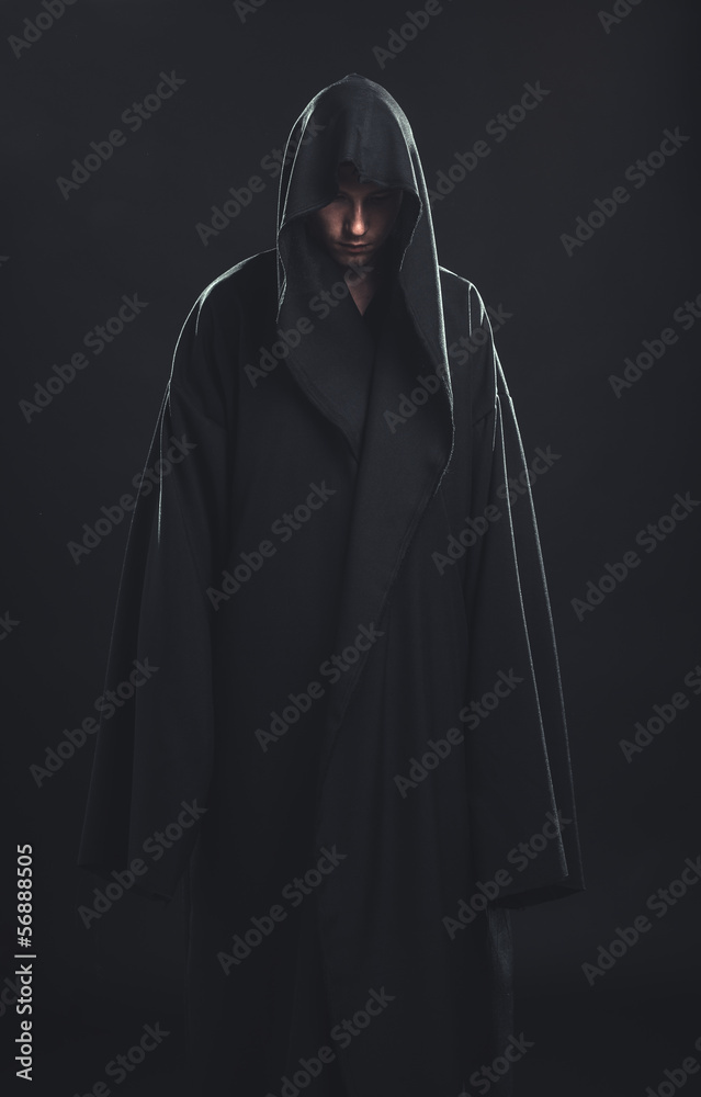 Portrait of man in a black robe StockFoto Adobe Stock