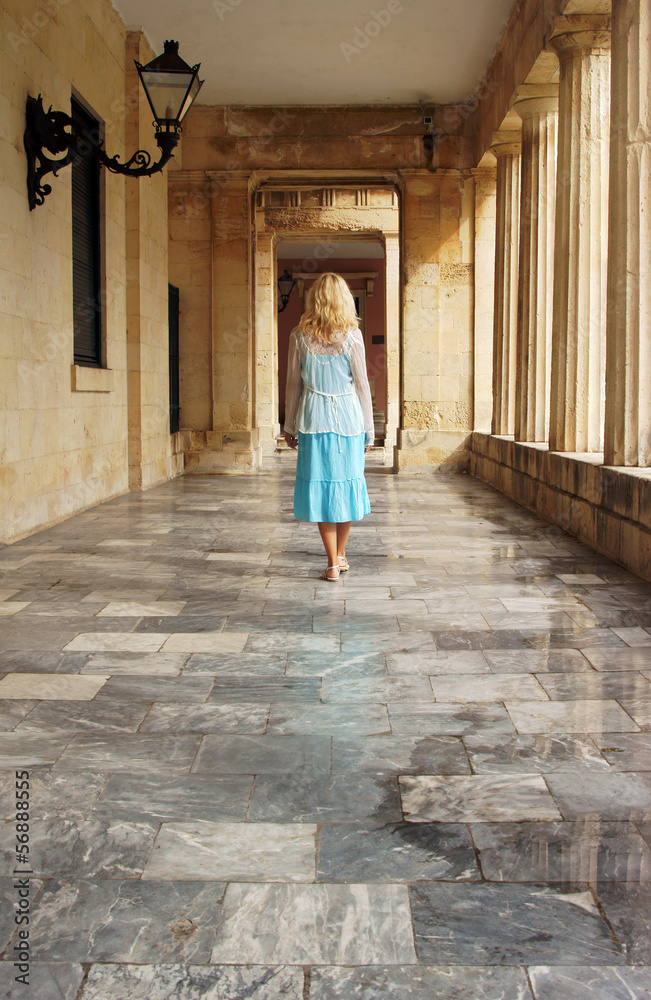The girl in the gallery of the Old Palace in Corfu, Greece.