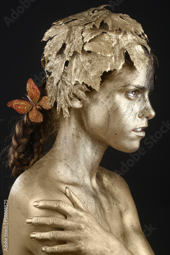 Beautiful Gold Painted Woman in Conceptual Beauty Themed Image
