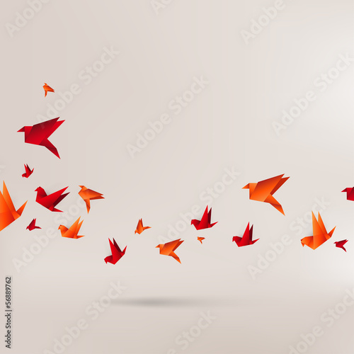 Origami paper bird on abstract background photo