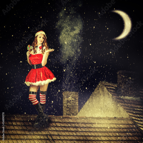 christmas fairy woman  in red dress and santa hat