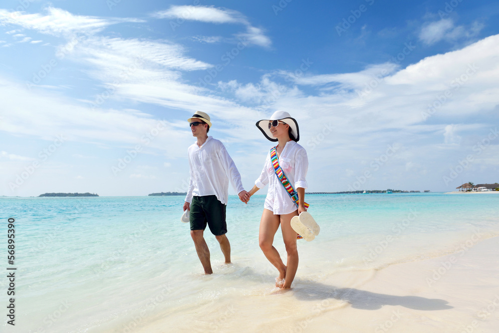 happy young couple have fun on beach happy young couple have fun on beach