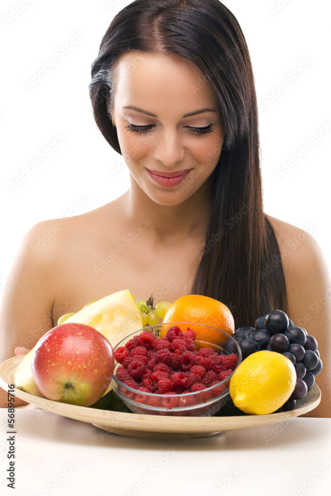 beautiful young woman holding a plate with fresh fruit beautiful young woman holding a plate with fresh fruit