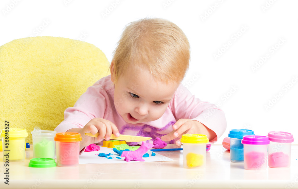 Happy kid girl playing with colorful clay toy Happy kid girl playing with colorful clay toy