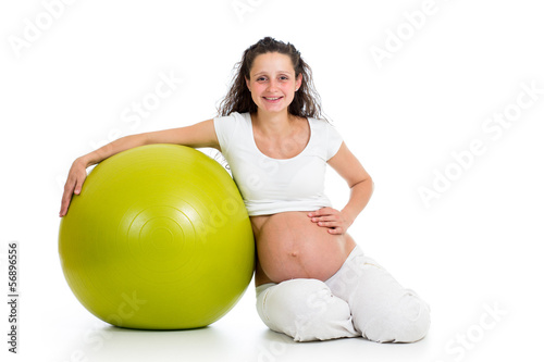 Pregnant woman excercises with gym ball