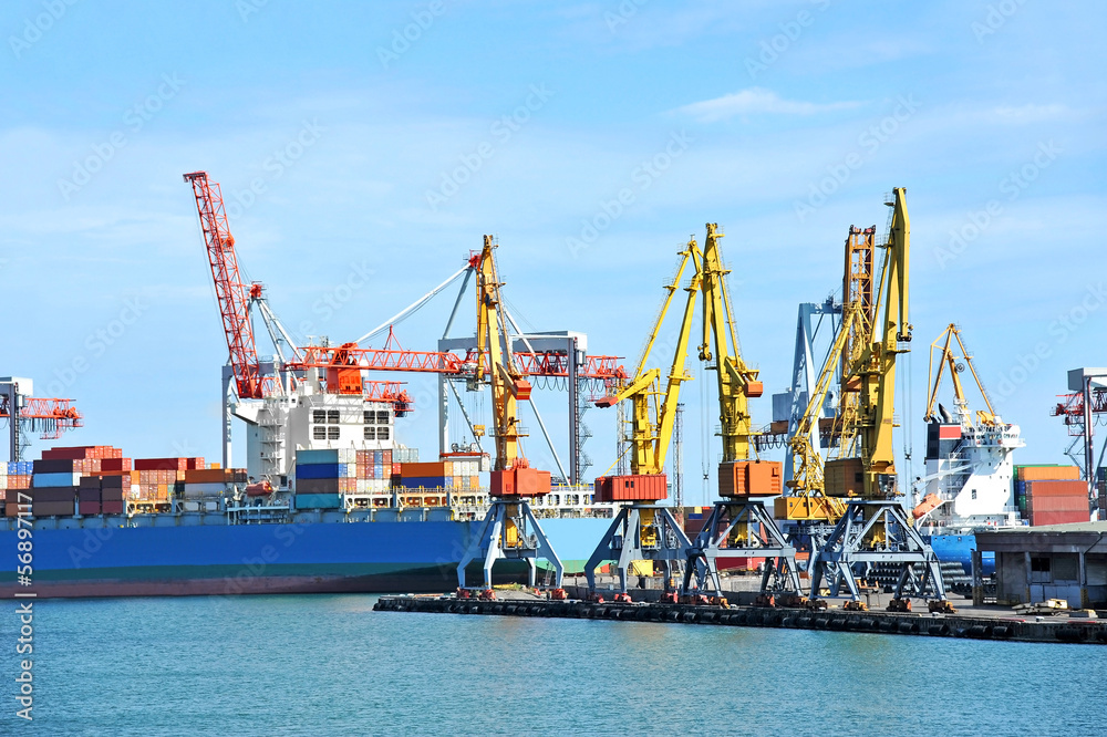 Container stack and cargo ship under crane bridge Container stack and cargo ship under crane bridge