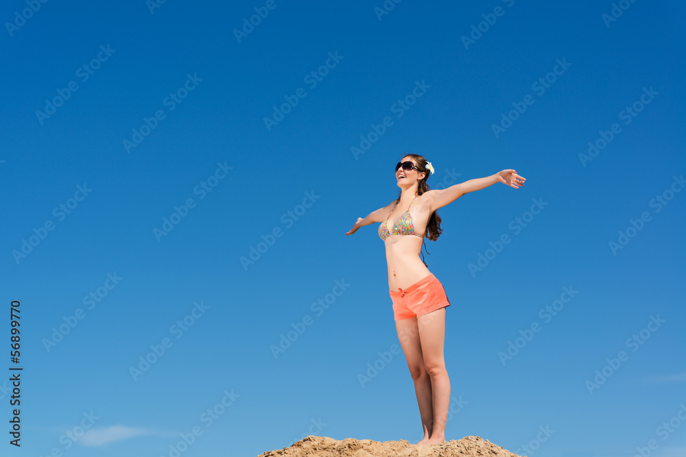 young woman on a background of blue sky