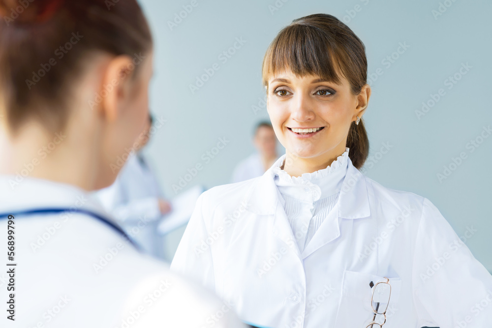 Doctor talking with a colleague Doctor talking with a colleague