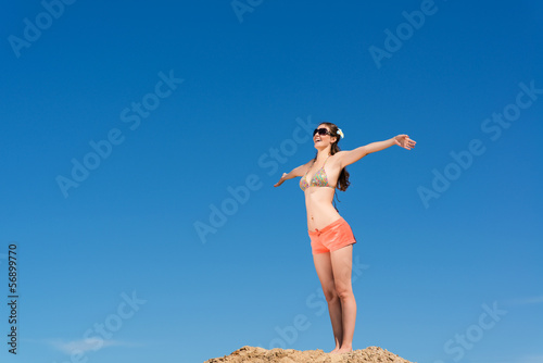young woman on a background of blue sky