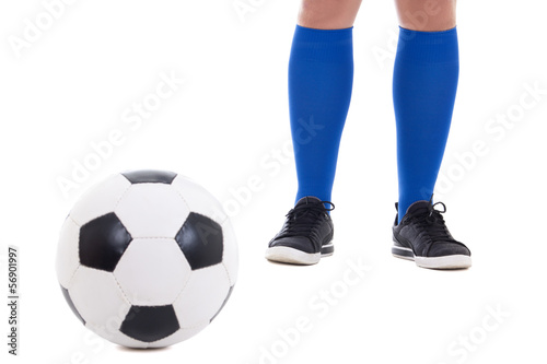 legs of soccer player in blue gaiters with ball isolated on whit