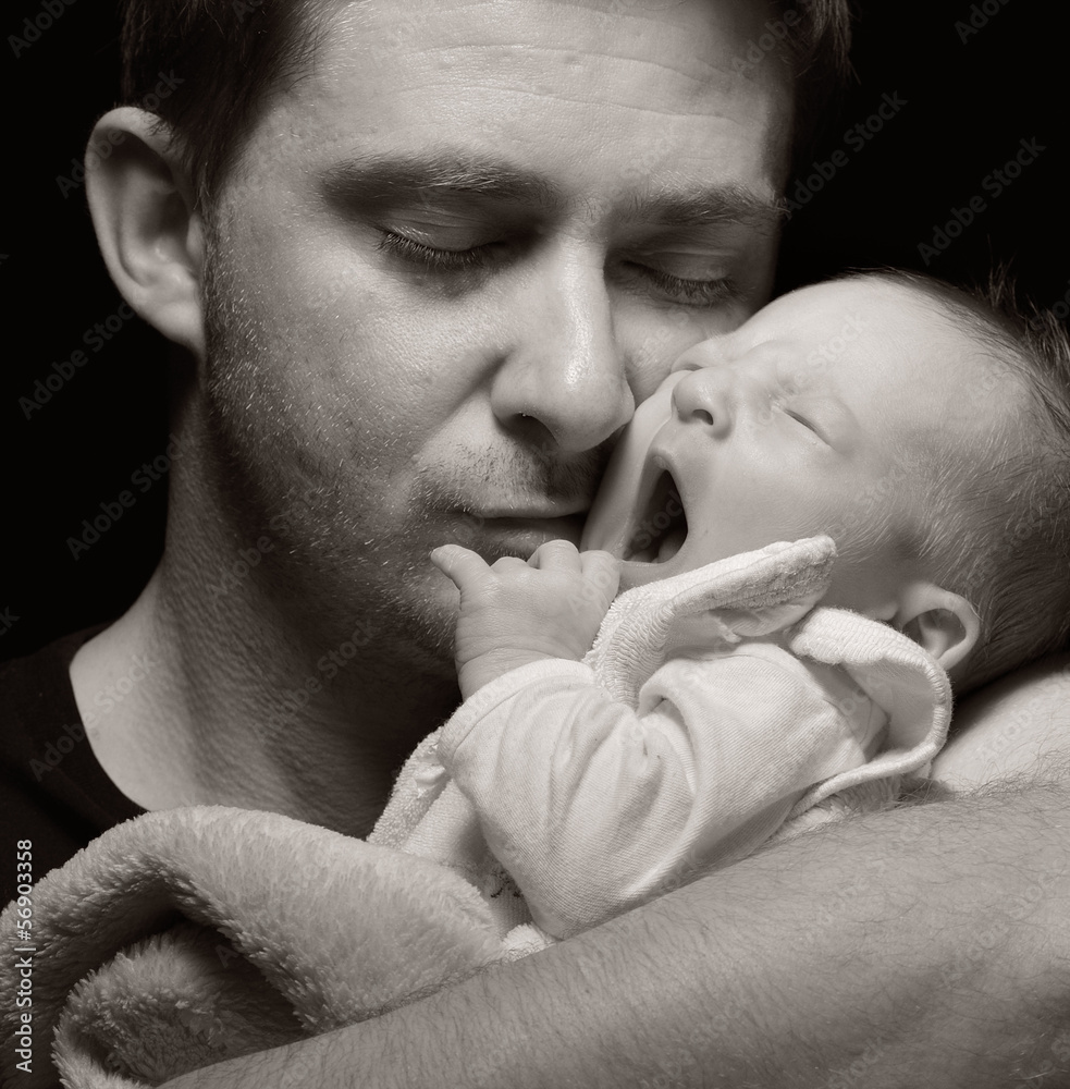 Father and his newborn baby.