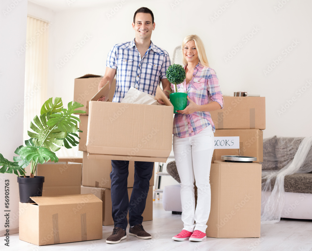 Cheerful couple their new home Cheerful couple their new home
