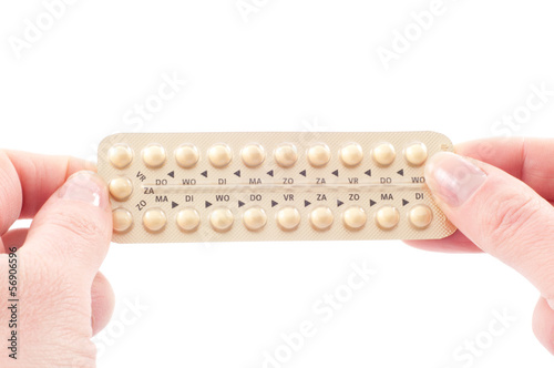 Holding a strip of pills