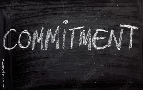 The word Commitment on a Blackboard photo