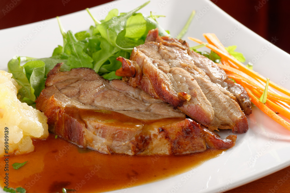 Fried pork chop, mashed potato and vegetable salad