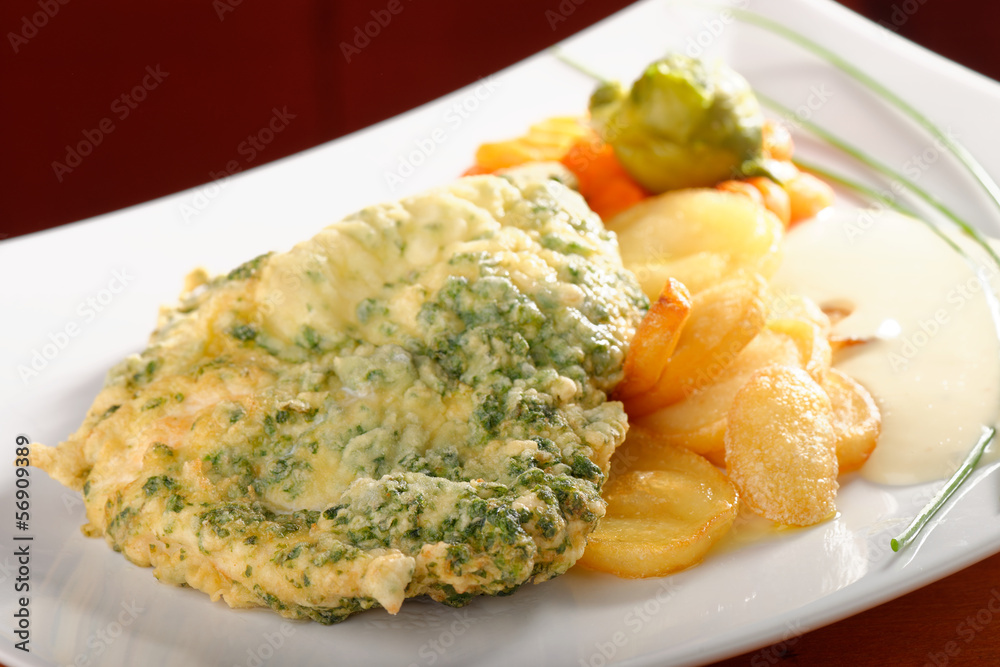 Pork chop with spices, potatoes and vegetables