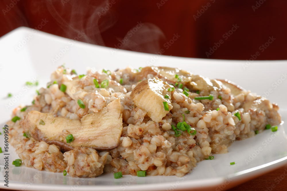 Buckwheat porridge with mushrooms and onions on the dining table Buckwheat porridge with mushrooms and onions on the dining table
