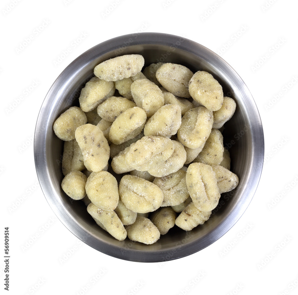 A bowl of potato gnocchi on a white background A bowl of potato gnocchi on a white background